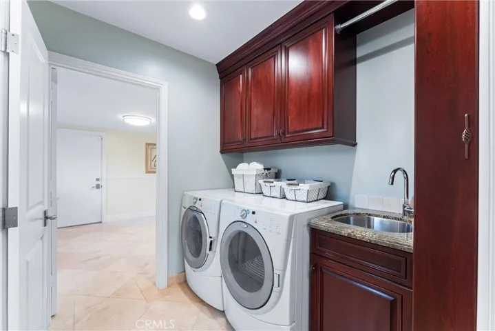Separate Laundry with sink and storage