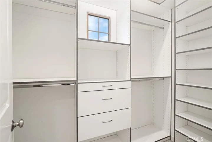Enjoy custom built-ins in primary bedroom closet!