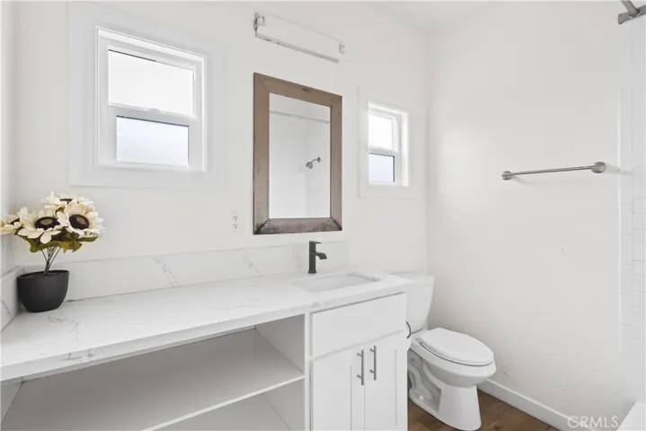 Fully remodeled bathroom feautures plenty of counter space and storage