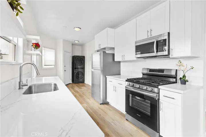 Spacious kitchen features plenty of cabinet and counter space