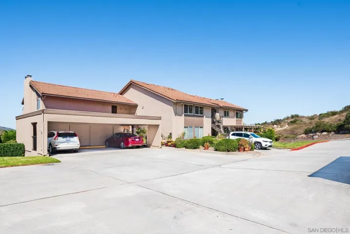 Building view including carport.