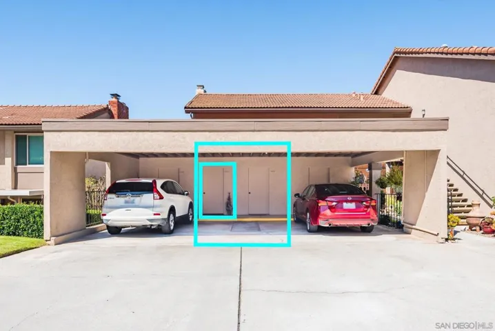 Carport area has storage room.