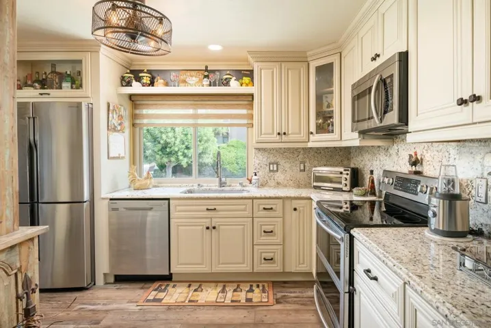 Samsung Suite appliance package. Sealed granite counters and full backsplash.