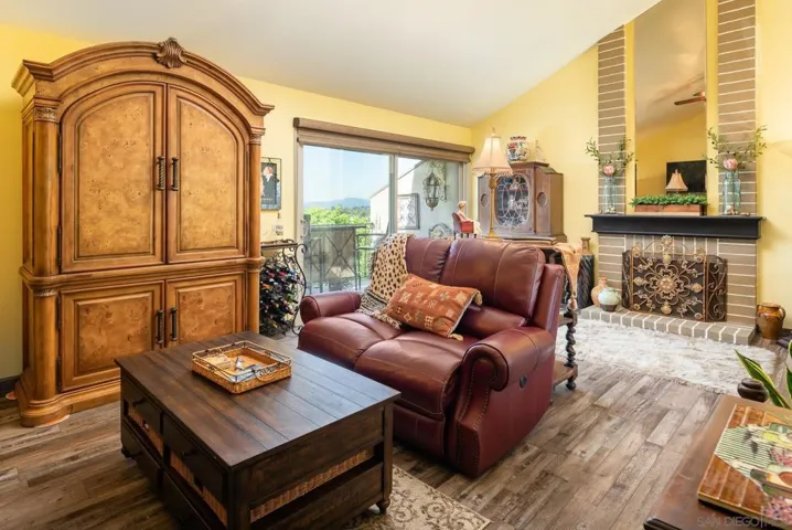 Actual color. Vaulted ceiling is spacious. Fireplace converted to gas log.