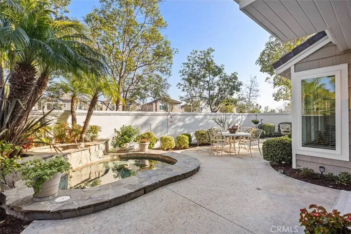 outdoor living space with spa