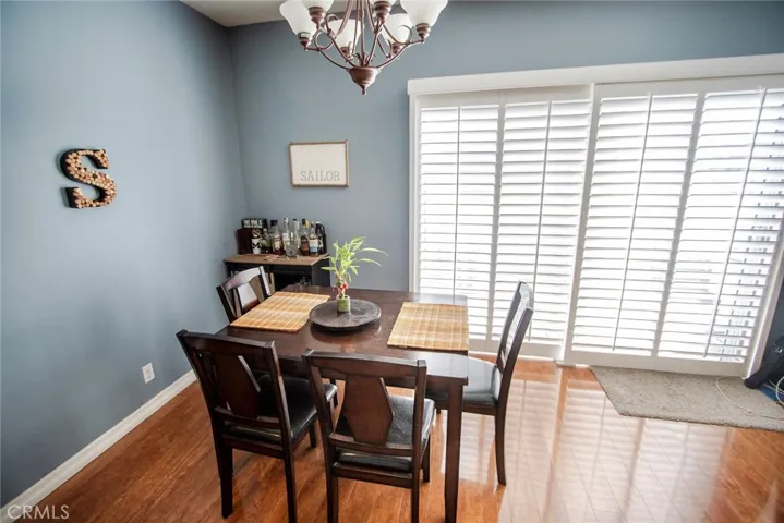 Large dining area with patio just behind those shutter doors.