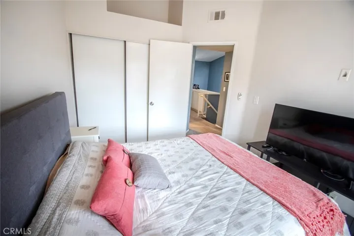 Secondary bedroom with a balcony.  Note that the closet doors will be replaced with 6 panel closet doors that are on order.