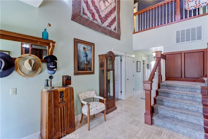 Grand entry w/beautiful wood touches throughout