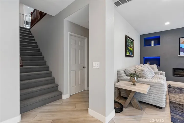 Second staircase leads to secondary bedrooms