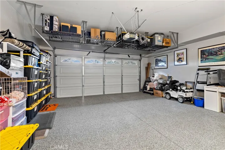 3 car tandem garage with epoxy sealed flooring! Upper storage racks included!