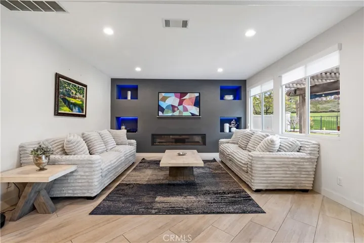 Custom family room with 6 foot linear gas fireplace!