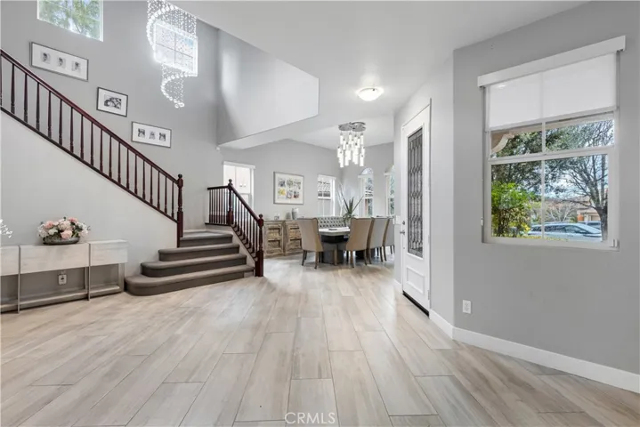 Experience the luxury as you enter this custom home with open kitchen and dining area!  dramatic LED chandeliers Elegant stained glass entry door! Wood grained porcelain tile flooring.