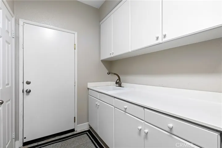 Laundry room with countertop and upper cabinets!