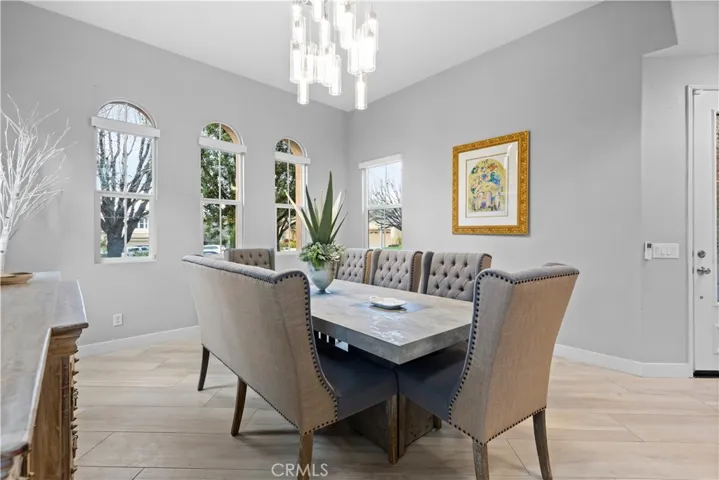Elegant chandelier and arched windows!