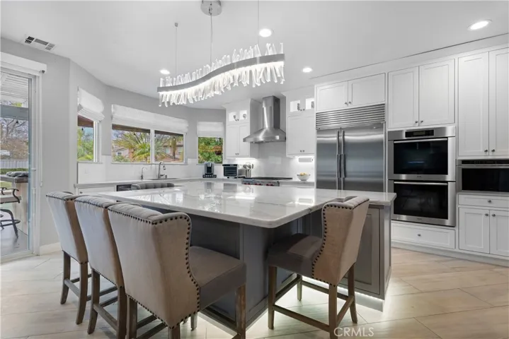 Beautiful oversized kitchen island with quartzite countertop! Gourmet cooks will enjoy the top of the line appliances!