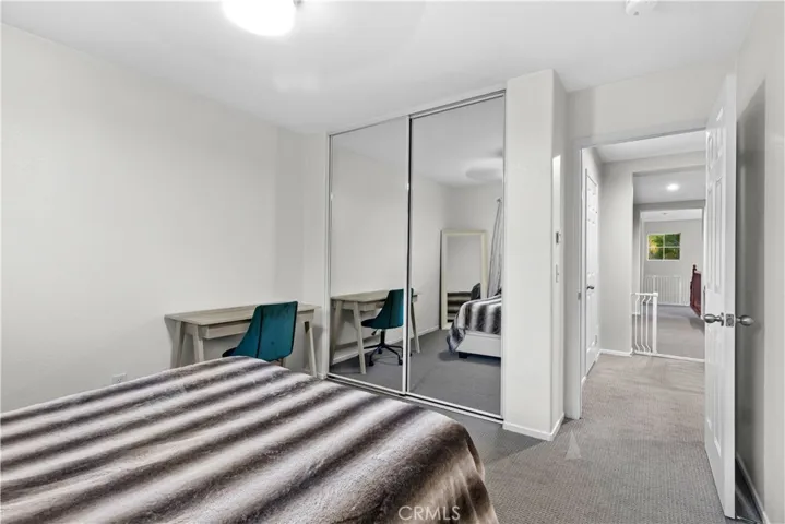 Mirror wardrobe sliding doors and ceiling fan! Also, California Closets built-in organizers!