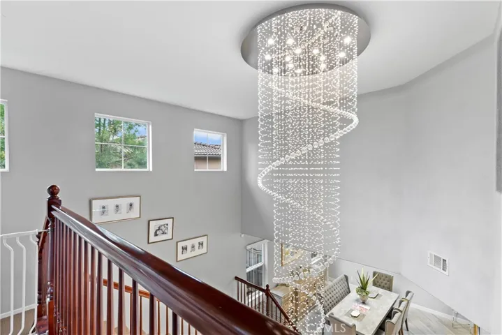 Elegant LED lighted chandelier highlights the main staircase!