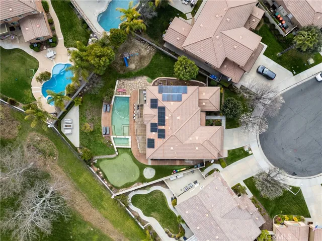 FULLY PAID SOLAR! Aerial view above home showing the 12,197 square foot lot!