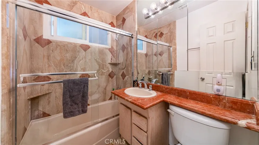 Marble Tile Bathroom with bath tub.