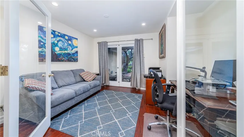 Bedroom 4 being used as office. French doors lead to court yard at entrance.