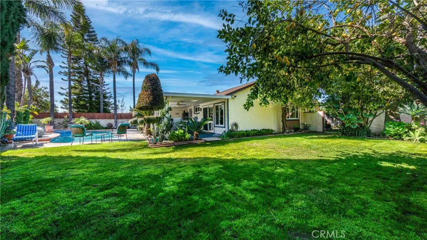 Plentiful backyard perfect for gatherings and kids. Mature Trees provide shade.