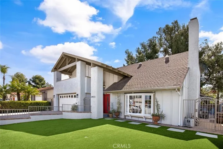 Low Maintenance large front yard space with artificial grass.