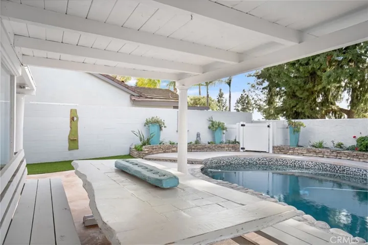 Artificial grass area on the side yard.