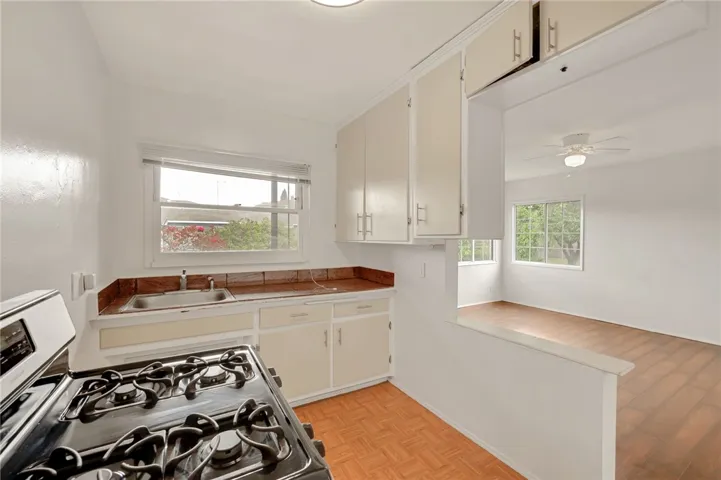 13775 kitchen with granite squares on countertop