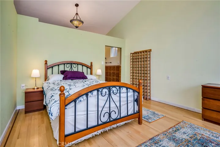 Primary bedroom with its attached bathroom