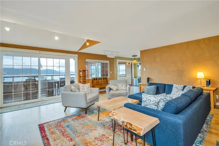 Living room opens to deck and lake
