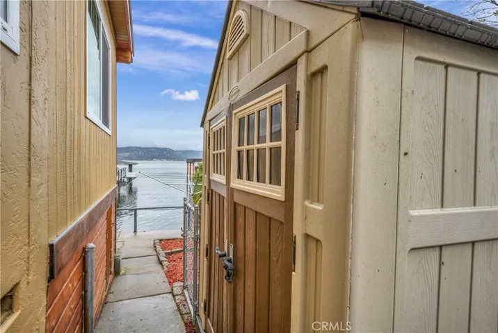 Side yard has a shed for extra storage.
