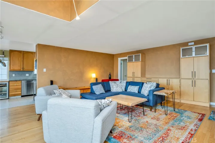 Living room opens to kitchenl fribt door is to the right of this photo

