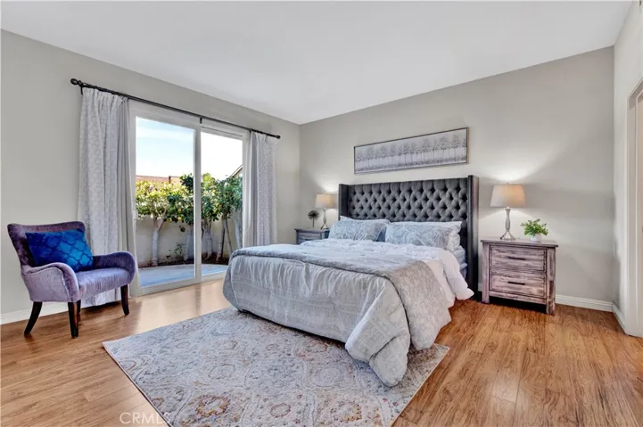 Master bedroom with sliding glass door to patio