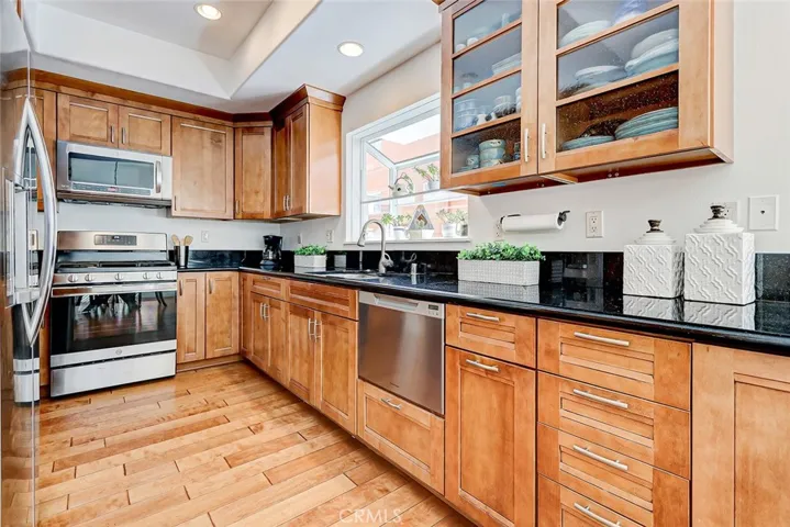 Warm wood cabinets, gleaming granite counters, stainless steel appliances.