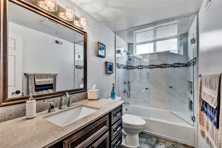 Remodeled Bathrooms with Designer Tile Surrounds, Double Shampoo Niches
