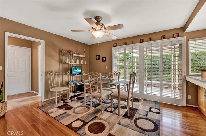 Family Room Combination Breakfast Room with Double Sliders that Open to a Covered Side Yard Patio