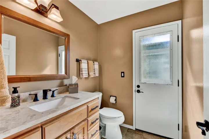 Remodeled Powder Room with Direct Access to the Beautiful Backyard with Pool