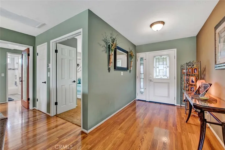 Step Inside the Elegant Foyer with Hardwood Flooring