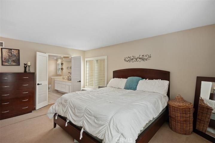Large primary bedroom with spacious full bathroom.