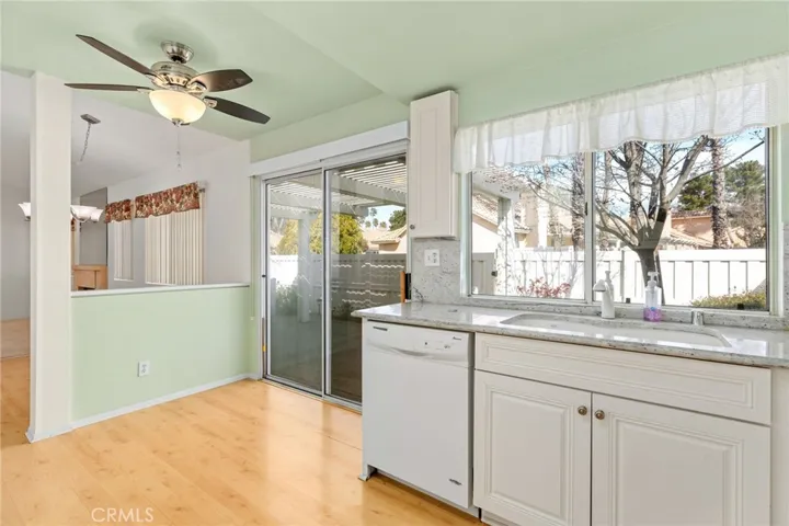 The kitchen has lots of sun light too