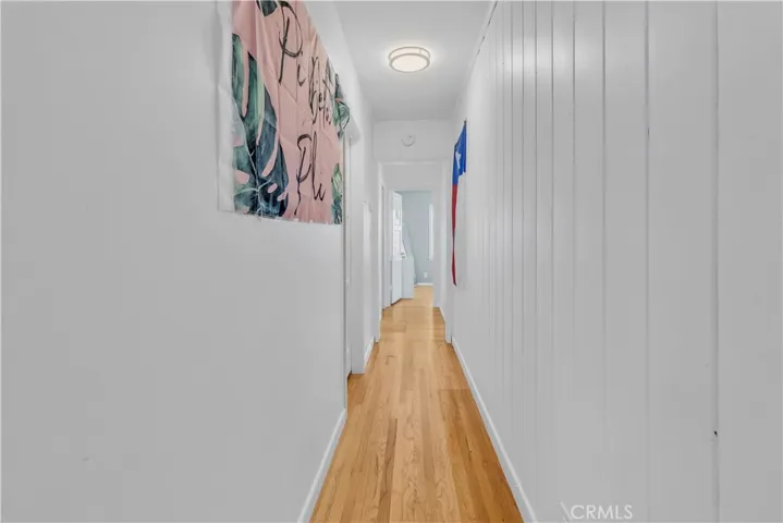 Long hallway to additional secondary bedrooms and primary​​‌​​​​‌​​‌‌​​‌​​​‌‌​​​‌​​‌‌​​‌‌​​‌‌​​​​ suite