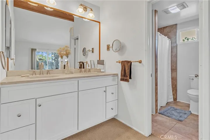 Bathroom #3 - Primary bath with dual sinks and walk in shower