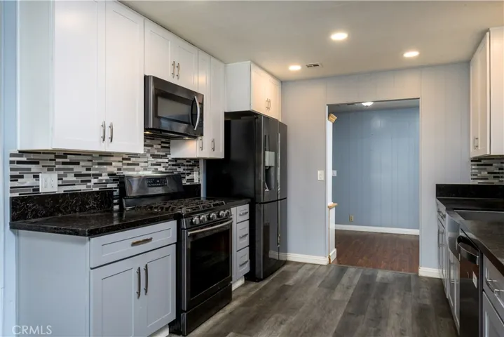 Lots of cabinets and beautiful counters