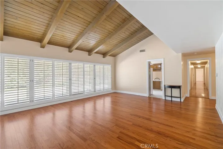Inside Main Living room looking toward "wall of windows" & kitchen area