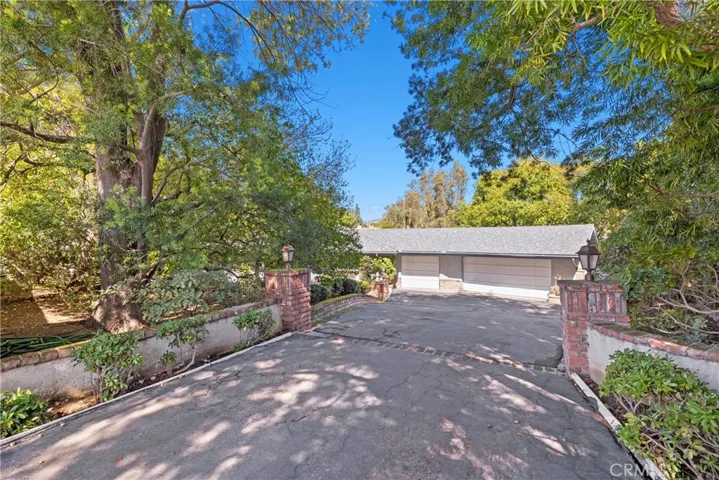Entrance to 18901 Camino Verde. Secluded, beautifully