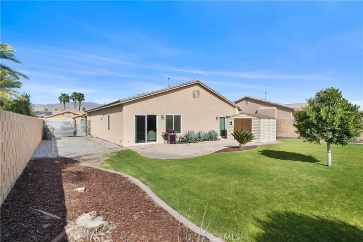 The side-yard provides ample for entertaining and potential for RV parking