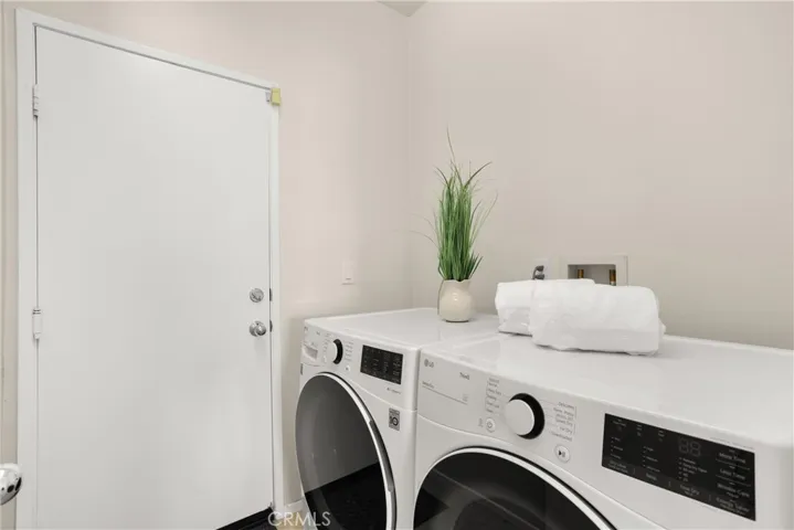 A separate laundry room provides total convenience