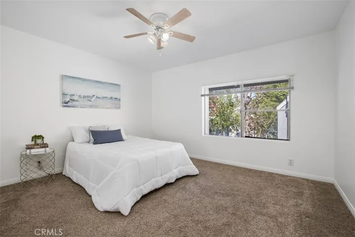 primary bedroom with ceiling fan