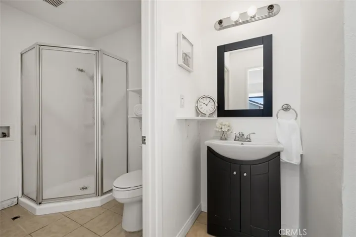 Bathroom #2 with walk in shower (and new stackable washer/dryer being installed this week)