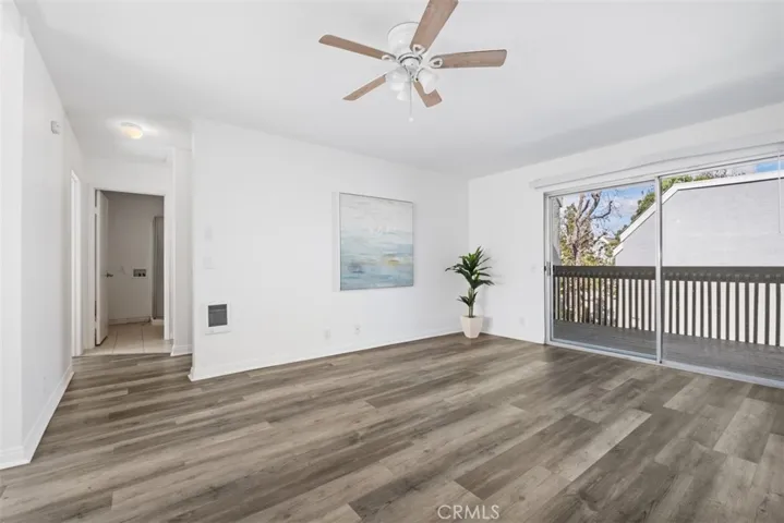 Bright living room with access to deck